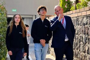 School leader discussing with students