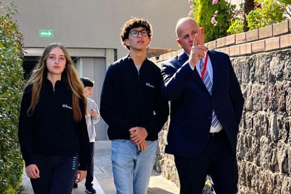 School leader discussing with students