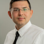 A headshot of Ildar Iliazov