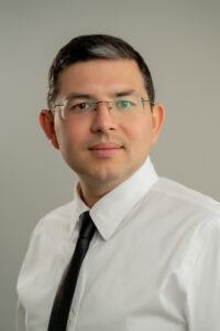 A headshot of Ildar Iliazov